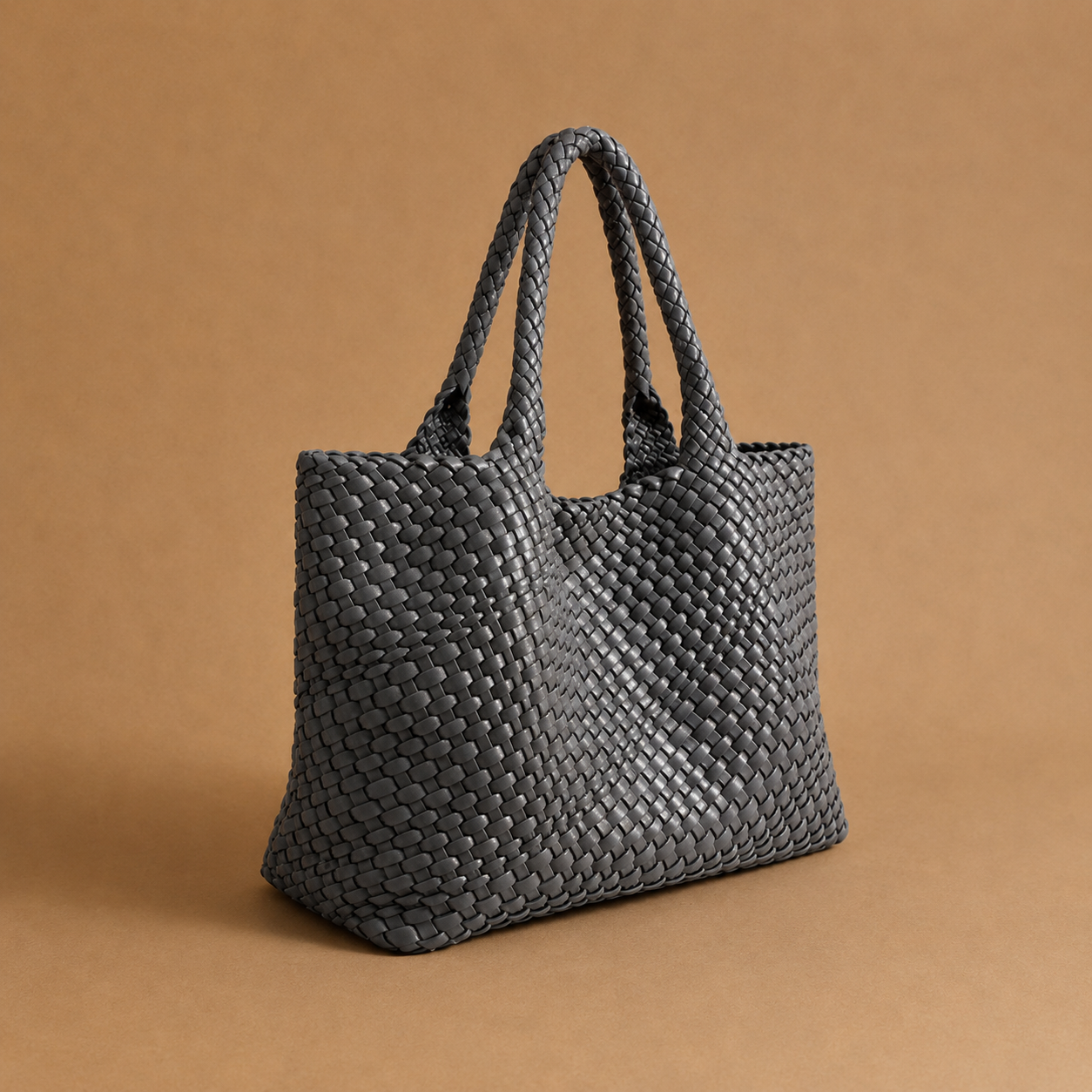Womens woven tote bag with top handles, dark grey woven texture.