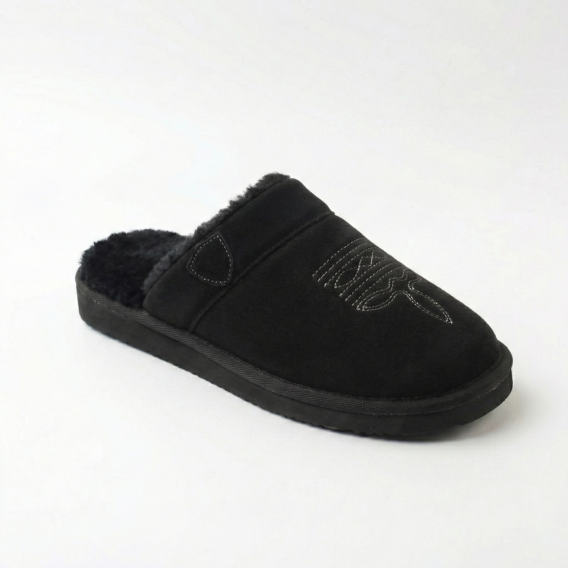 Cowboy slippers in black suede with faux-fur lining, stitched cowboy motif, and thick sole.
