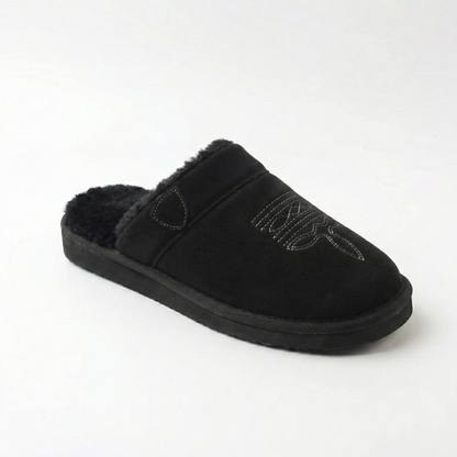 Cowboy slippers in black suede with faux-fur lining, stitched cowboy motif, and thick sole.