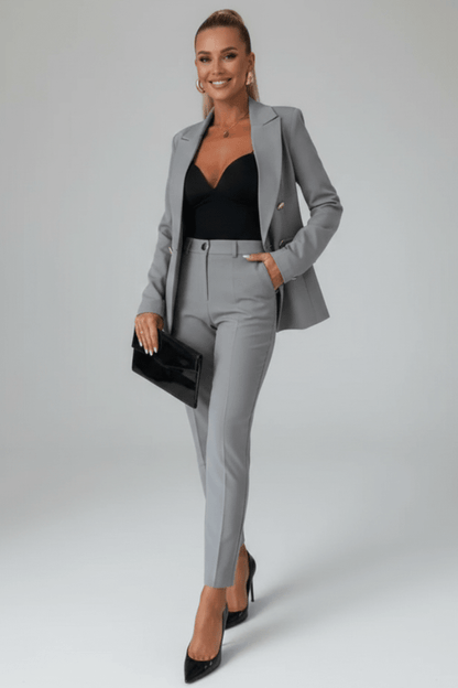 Gray blazer and matching trousers suit with notched lapels and pocket detail