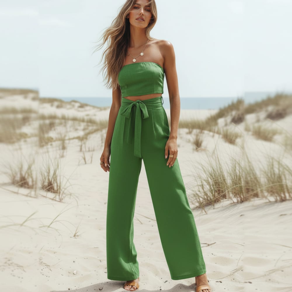Green strapless wide-leg jumpsuit with bow tie waist and wide trouser legs