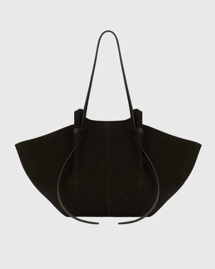 Black suede tote bag with long handles and drawstring top