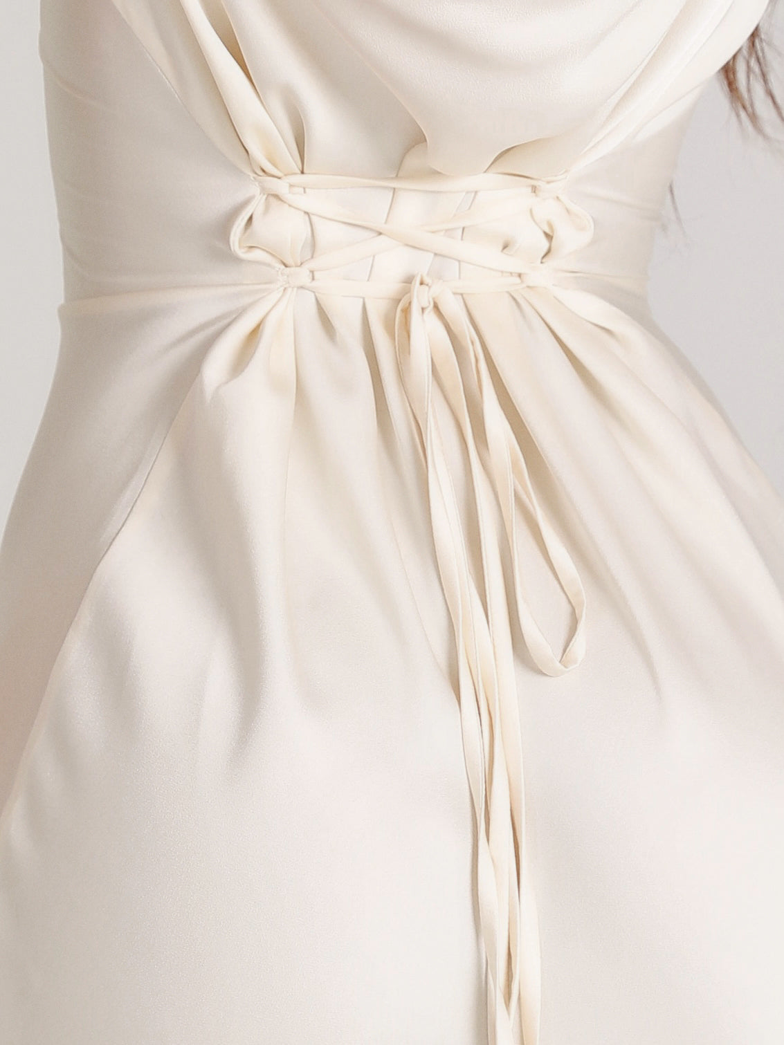 Off-white maxi dress close-up: ruched drawstring waist tie with long sleeves