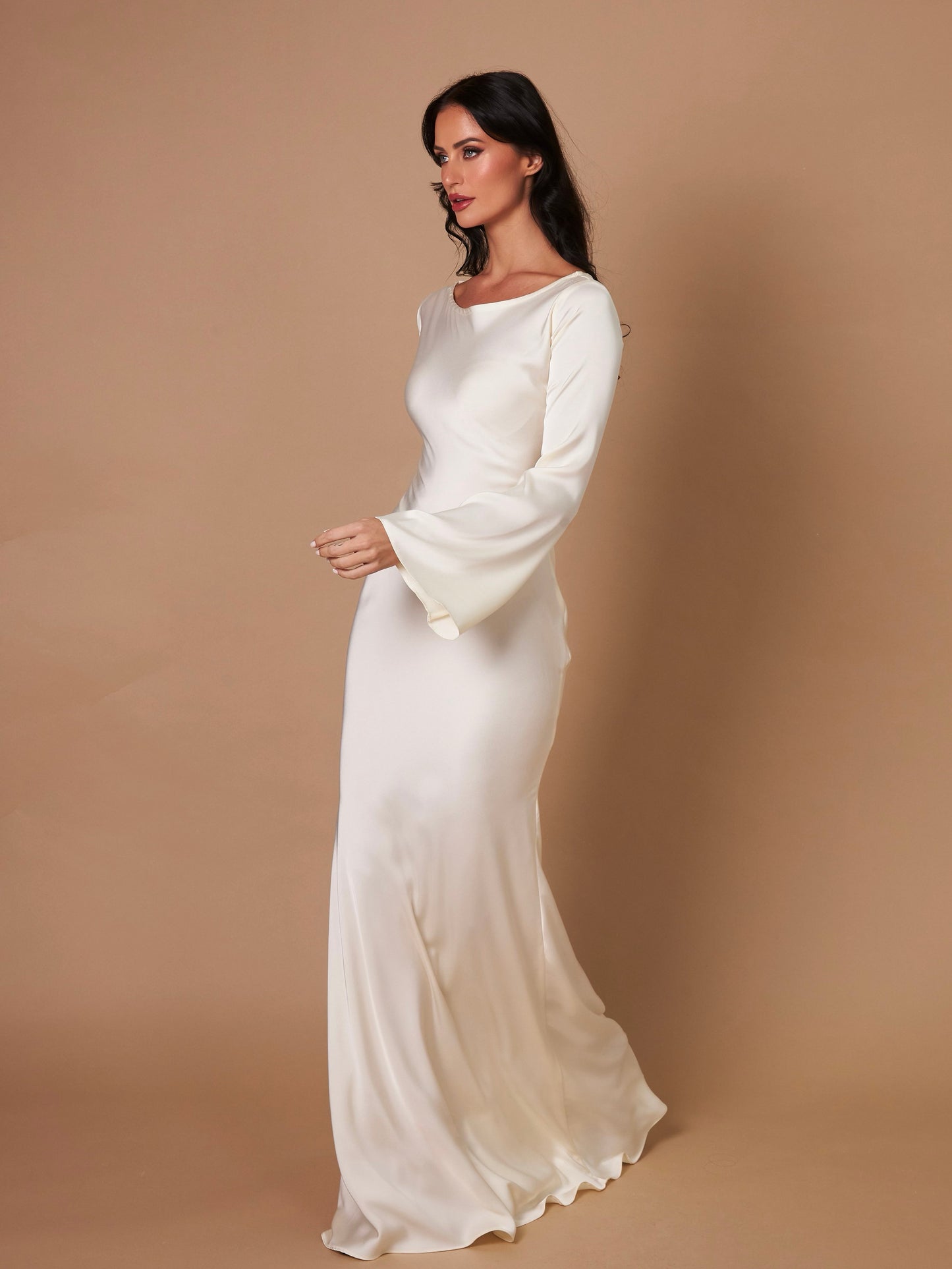 Cream long-sleeve maxi dress, side view, round neck and smooth draped skirt