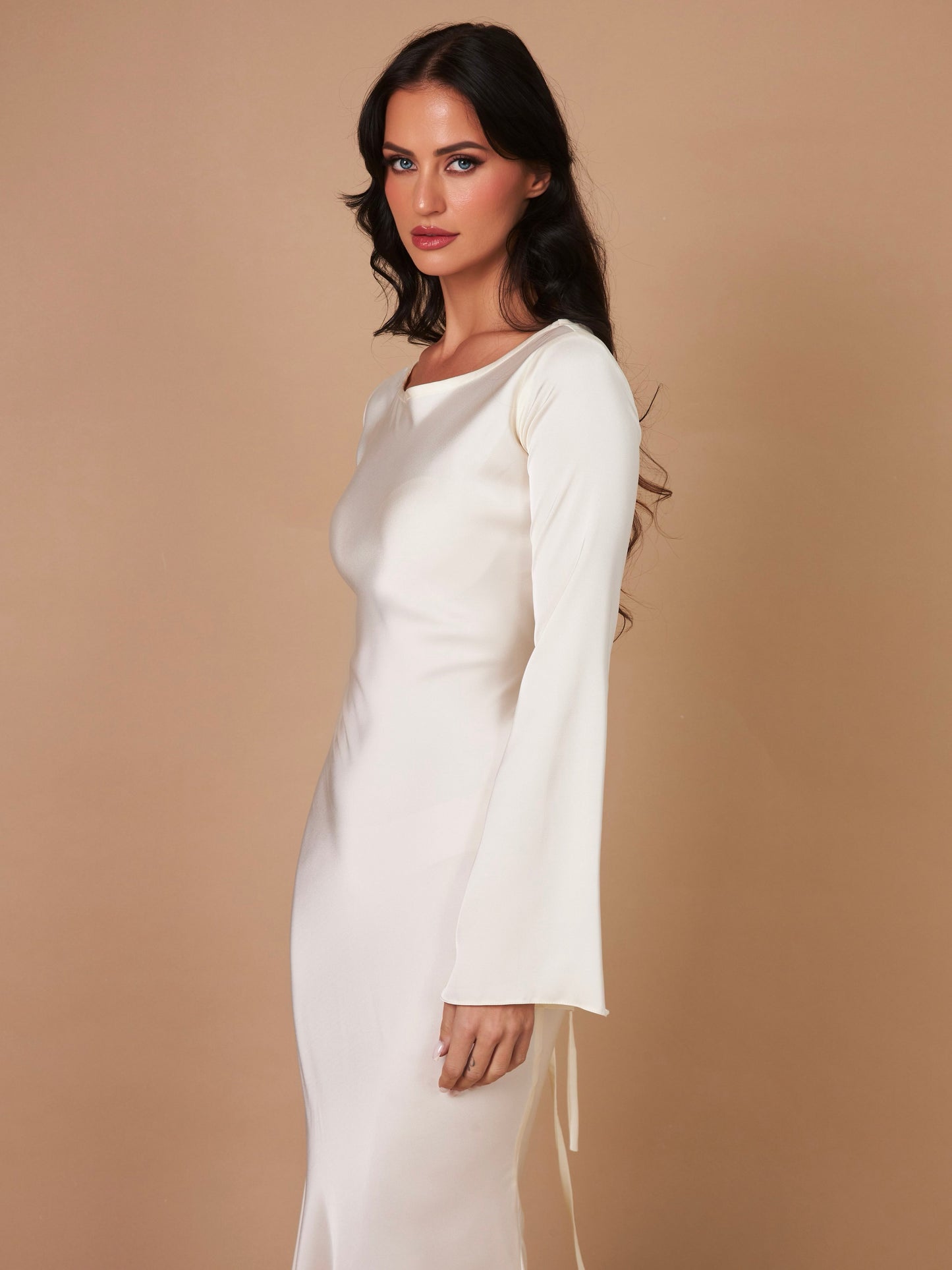 Cream long-sleeve maxi dress with round neckline and straight, fitted silhouette