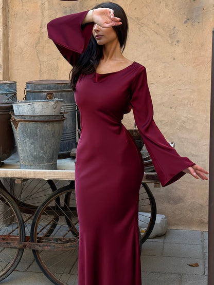 Burgundy long-sleeve maxi dress with scoop neckline and bell sleeves
