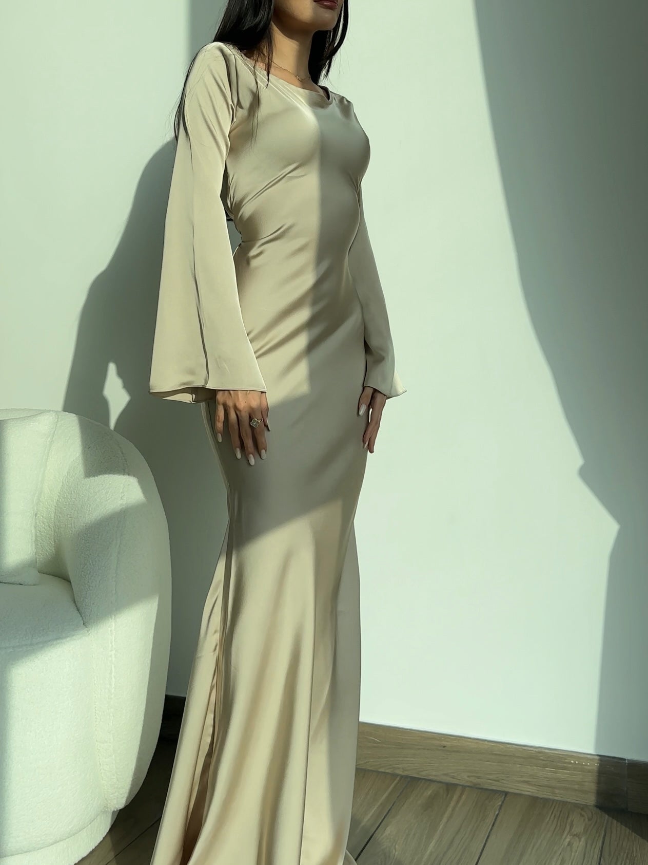 Light cream long-sleeved maxi dress with sleek seams and column silhouette