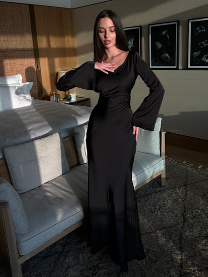 Black long-sleeved maxi dress with fitted waist and soft V neckline
