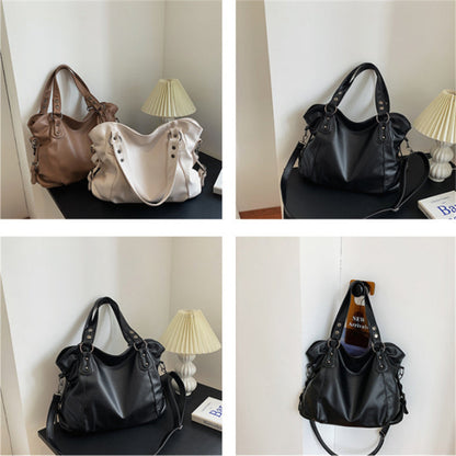 Vegan leather handbag collection in black, beige, and brown on a shelf display