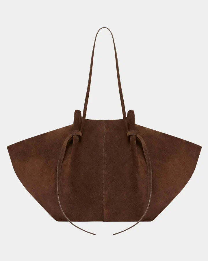 Brown suede tote bag with long handles and gathered drawstring opening