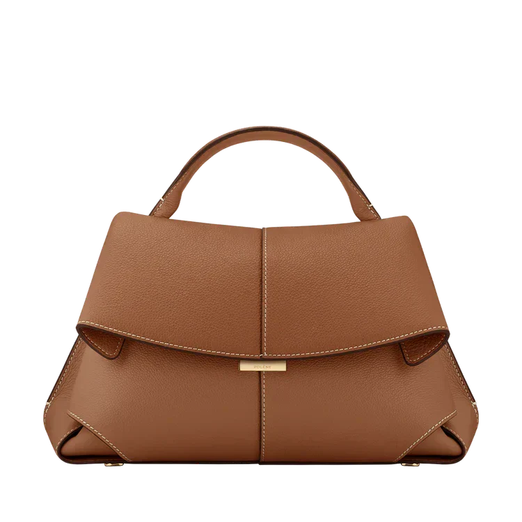 Tan vegan leather handbag with short handles and front flap with gold clasp