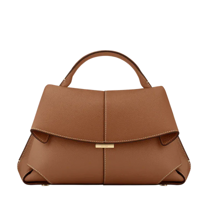 Tan vegan leather handbag with short handles and front flap with gold clasp
