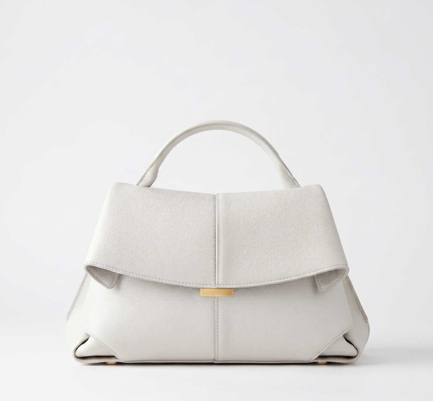 Off-white vegan leather handbag, short handles, front flap closure