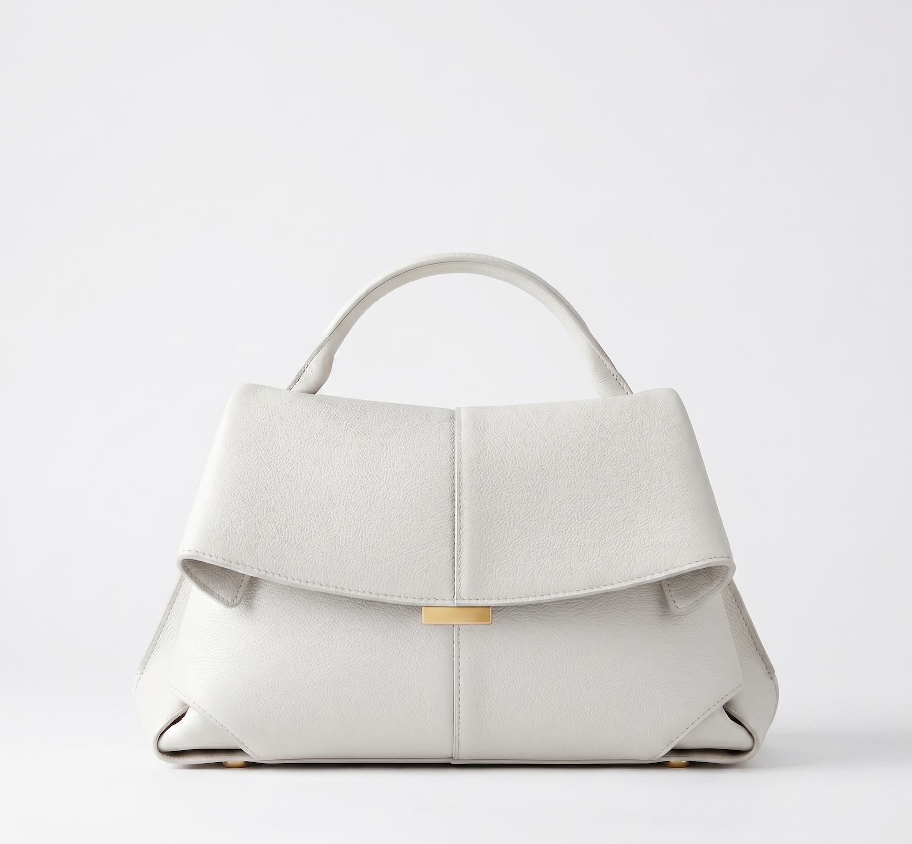Off-white vegan leather handbag, short handles, front flap closure