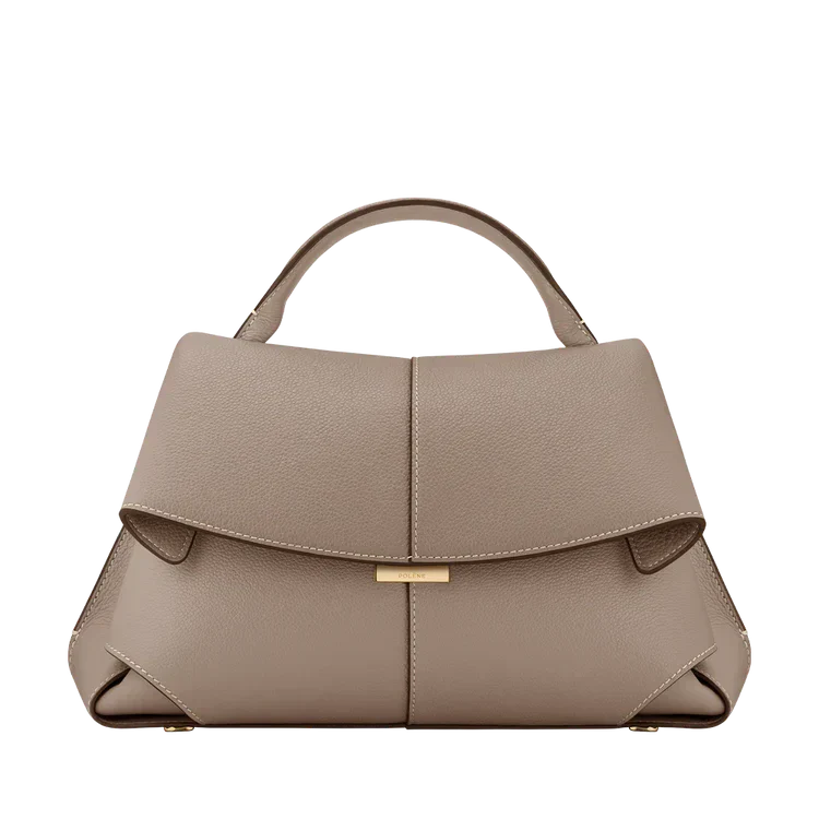 Beige vegan leather handbag with short handles and front flap gold clasp