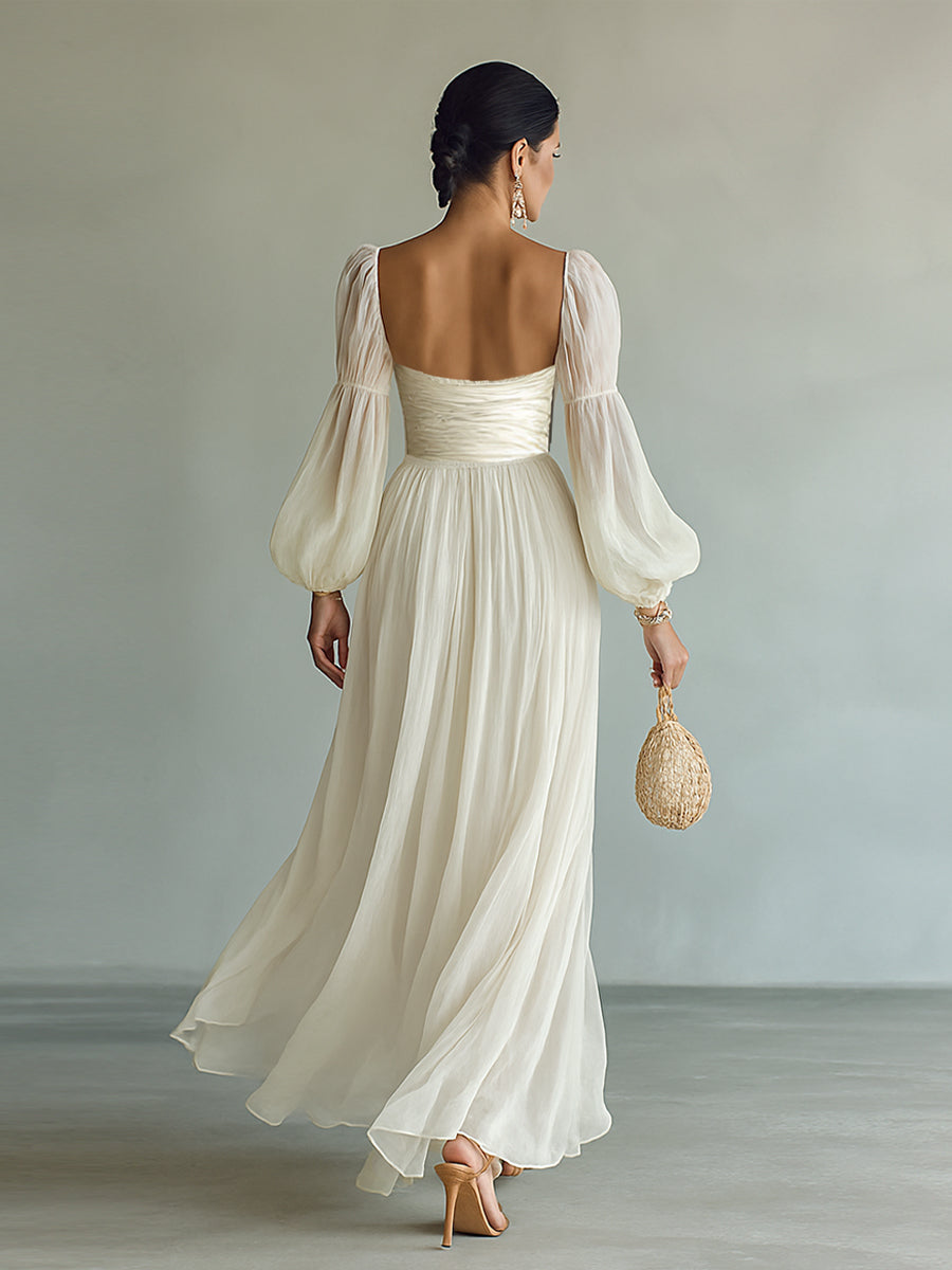 White chiffon maxi dress with open back, gathered waist and long puff sleeves