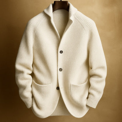 Men's ribbed wool cardigan in white with shawl collar, button front, two patch pockets.