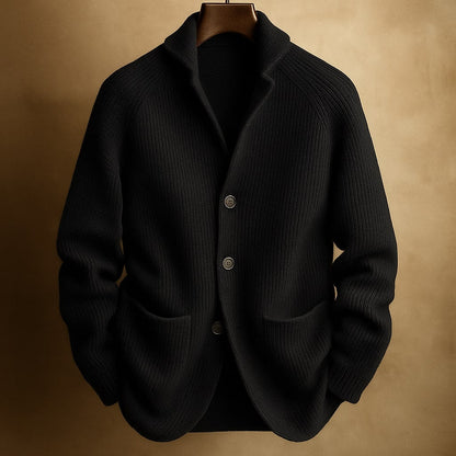 Men's ribbed wool cardigan in black with shawl collar, button front, two patch pockets.
