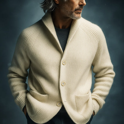 Men's ribbed wool cardigan in cream white with shawl collar, button front, patch pockets.