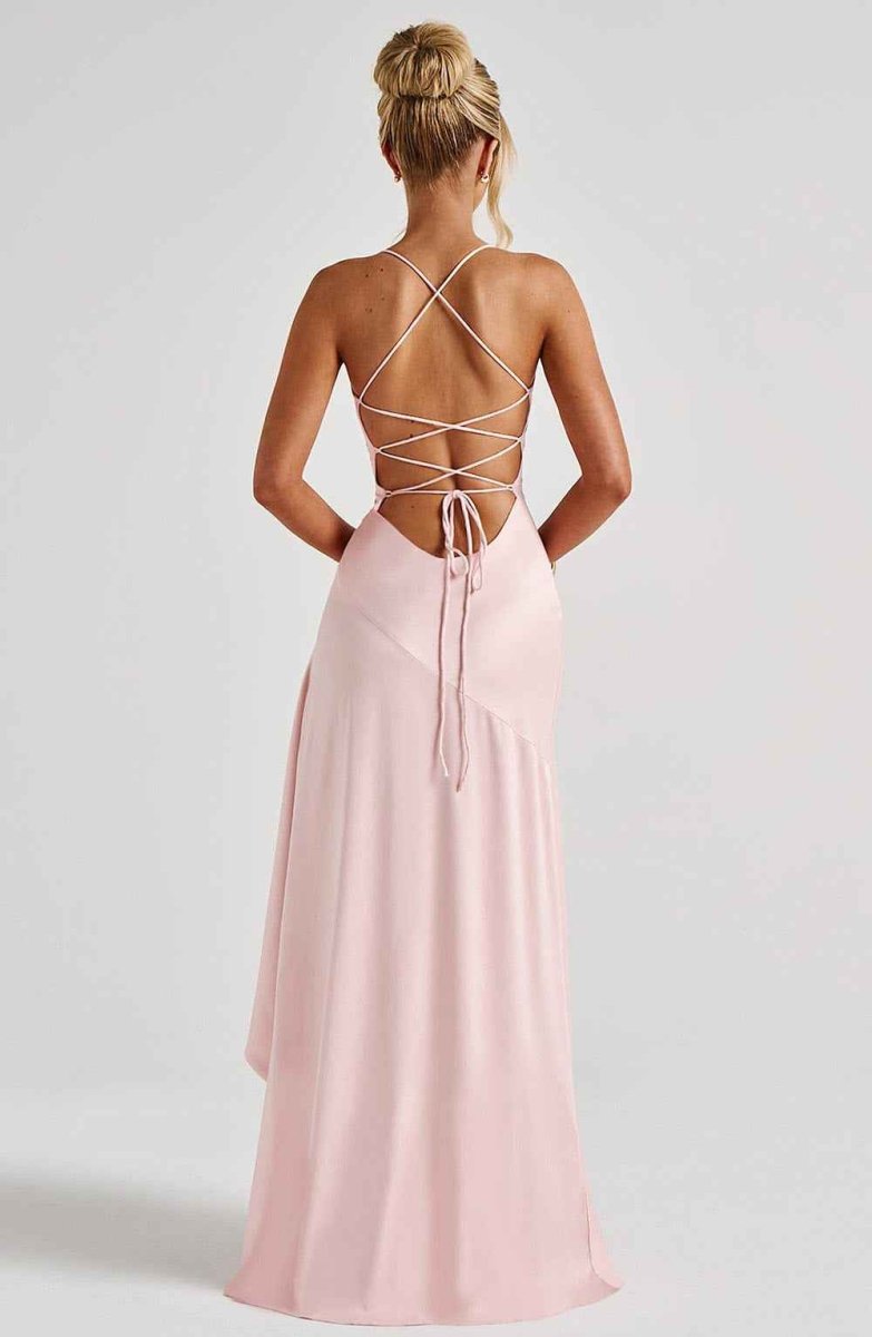 Light pink ruffle-hem maxi dress with crisscross open-back and tied straps