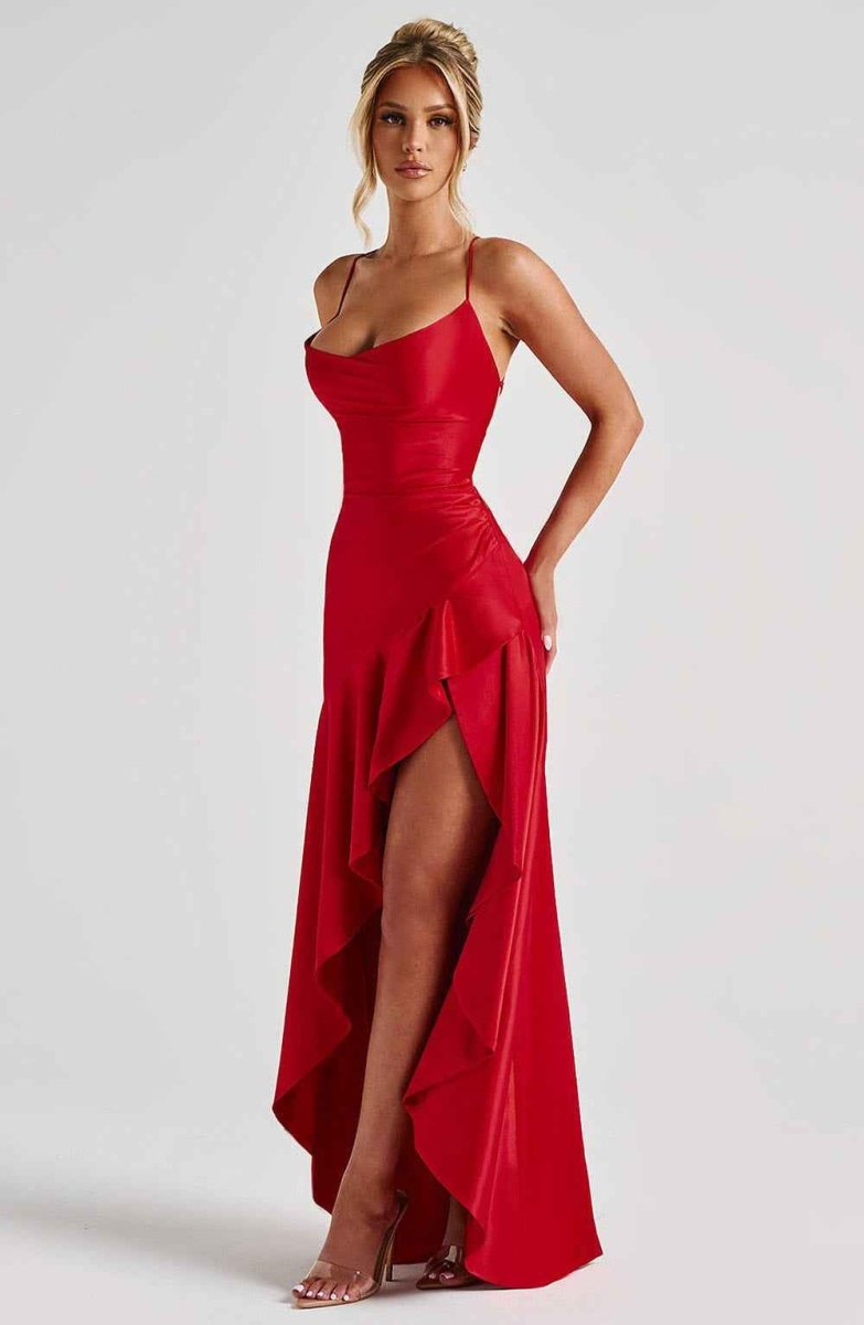 Red maxi dress with spaghetti straps, draped ruffle hem, and side slit.