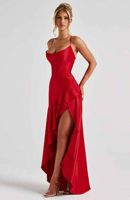 Red maxi dress with spaghetti straps, draped ruffle hem, and side slit.