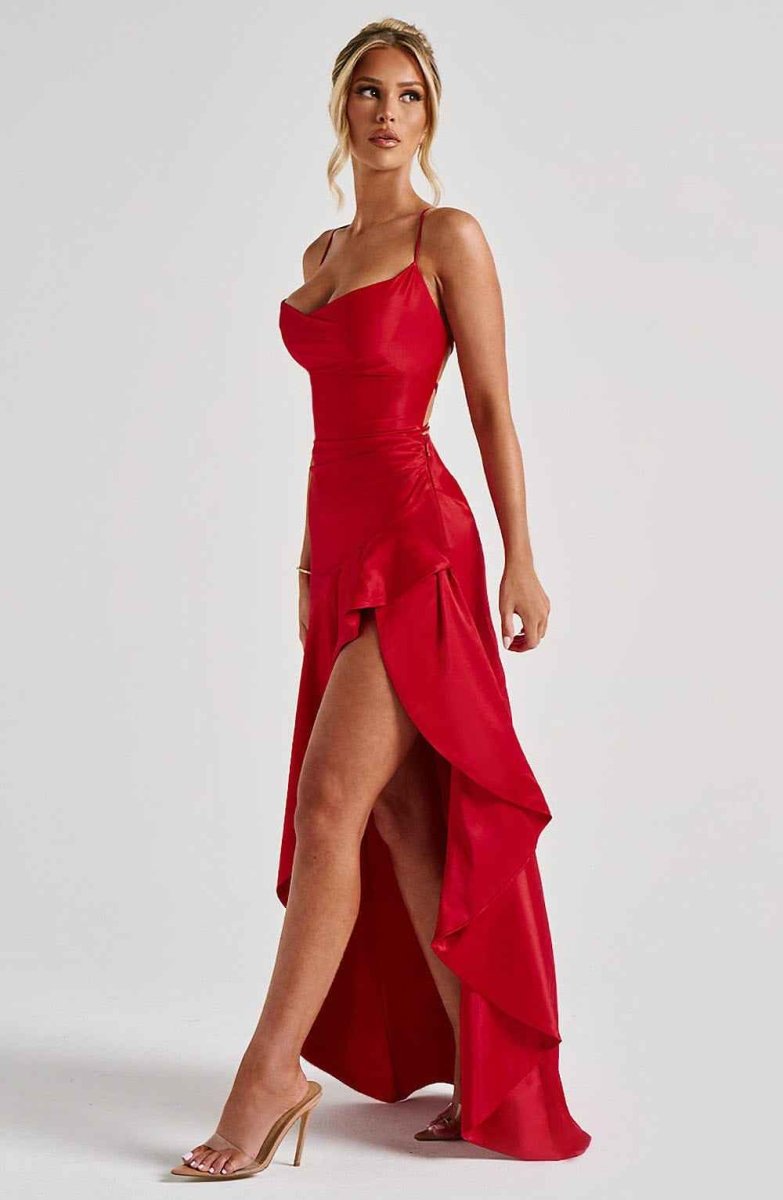 Red ruffle-hem maxi dress with spaghetti straps, fitted waist, and side slit
