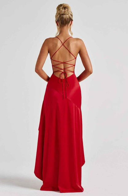 Red open-back maxi dress with crisscross lace-up straps and flowing skirt