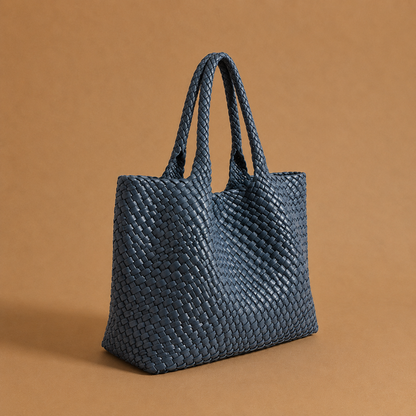 Womens woven tote bag with top handles, blue woven texture.