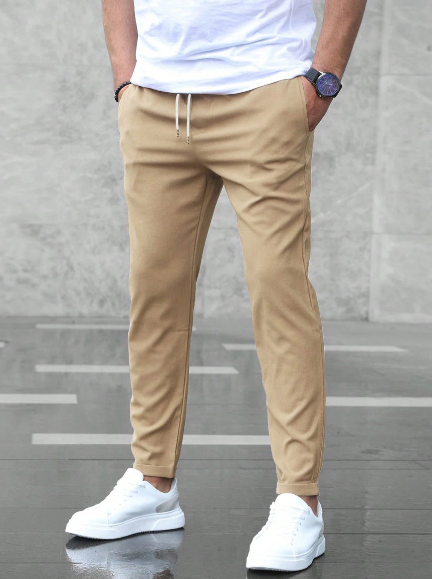 Mens khaki drawstring jogger pants with tapered fit and ankle cuffs