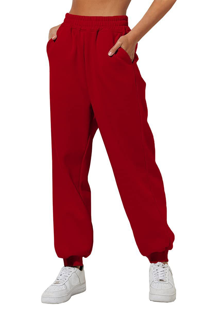 Red sweatpants with elastic waistband, drawstring, and cuffed ankle hems.