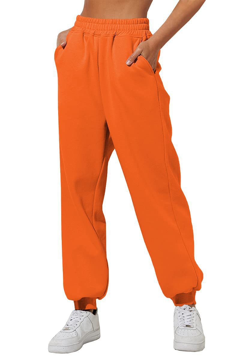 Orange sweatpants with elastic waistband, drawstring, and cuffed ankle hems.
