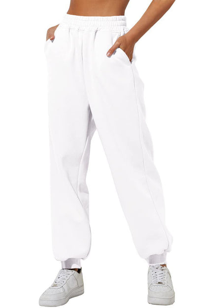 White sweatpants with elastic waistband, drawstring, and cuffed ankle hems.