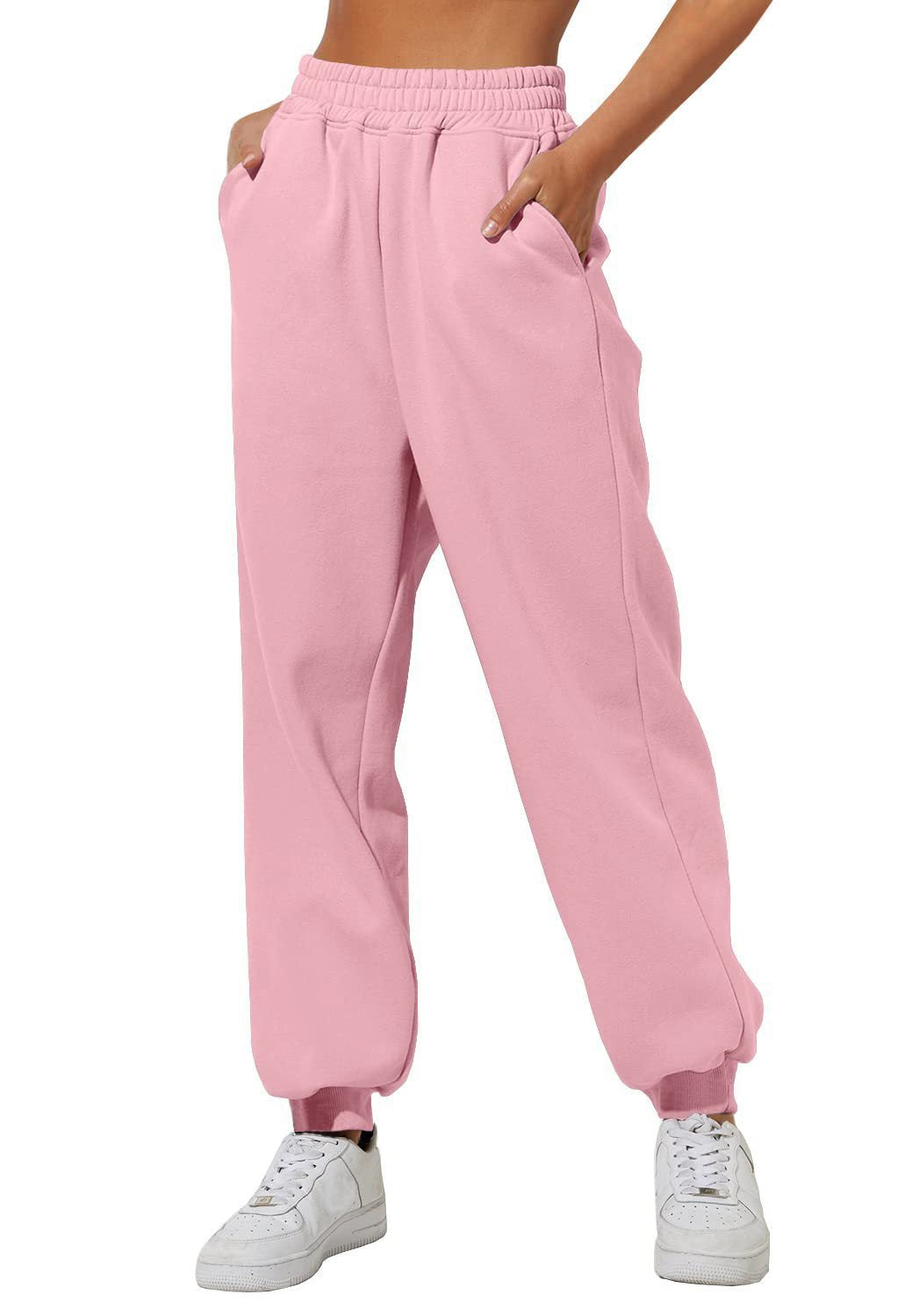 Pink sweatpants with elastic waistband, drawstring, and cuffed ankle hems.