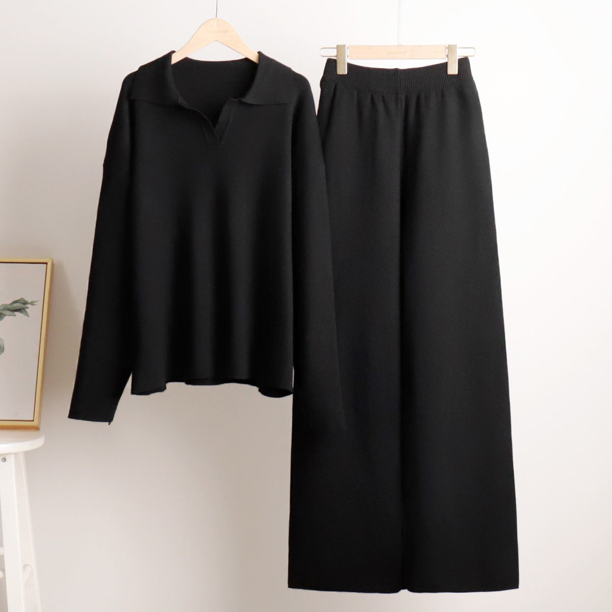 Women’s knit polo set with wide-leg trousers, black hanging set