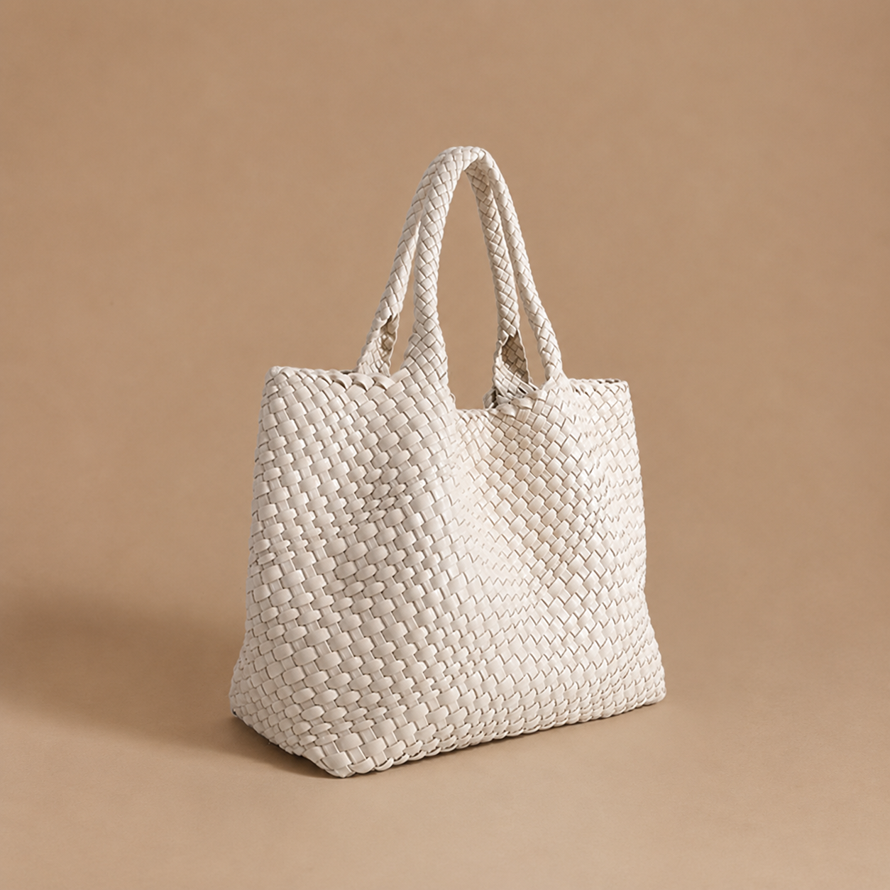 Womens woven tote bag with top handles, off-white woven texture.