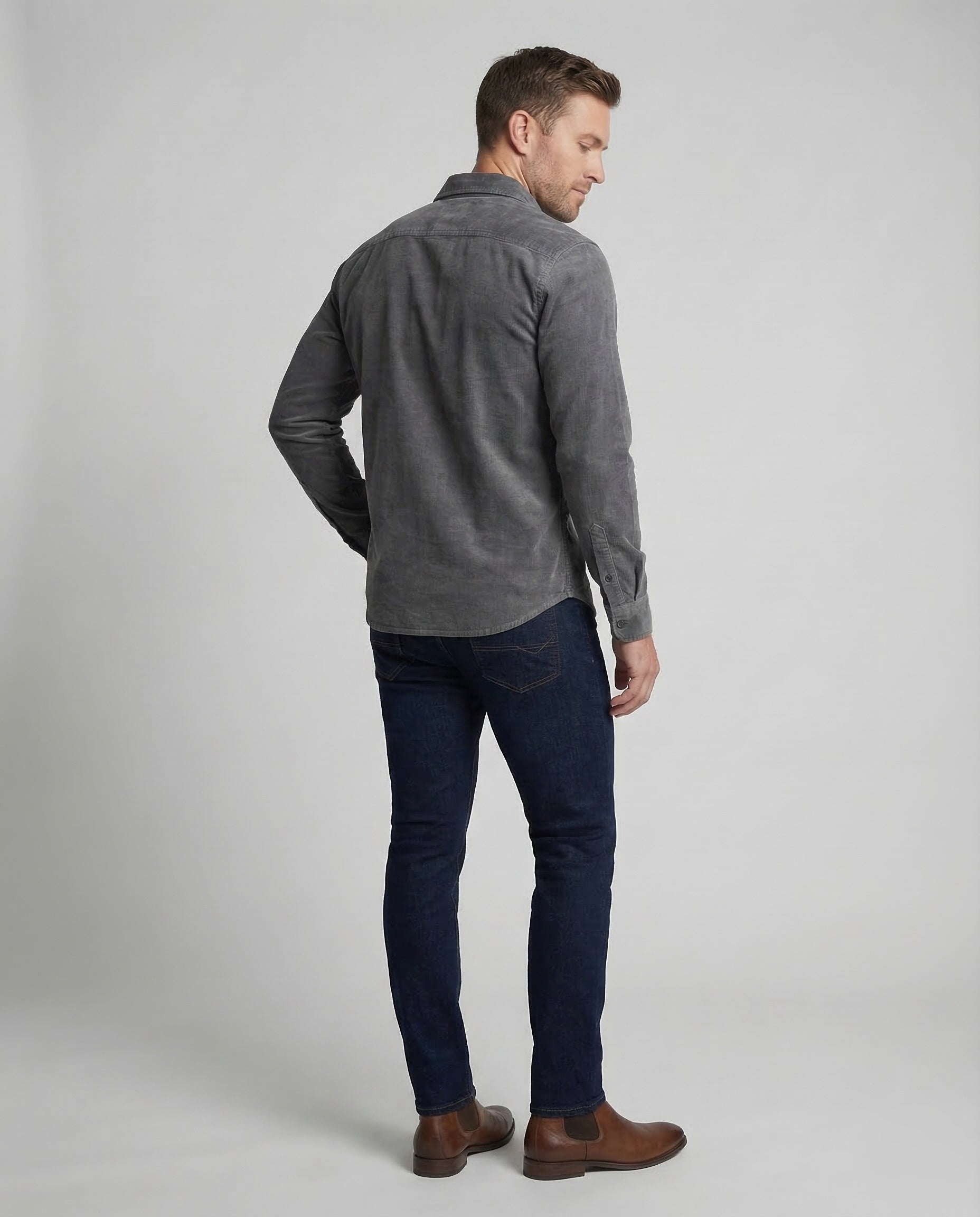 Men's grey corduroy utility shirt, back view with long sleeves and buttoned cuffs