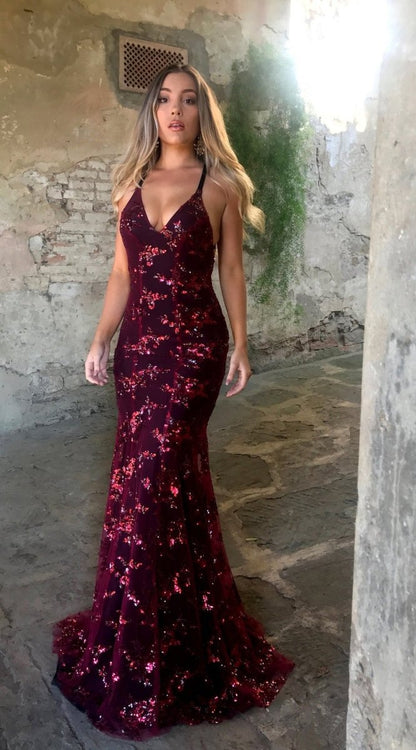 Burgundy sequin evening dress with V-neckline, thin spaghetti straps, and mermaid skirt