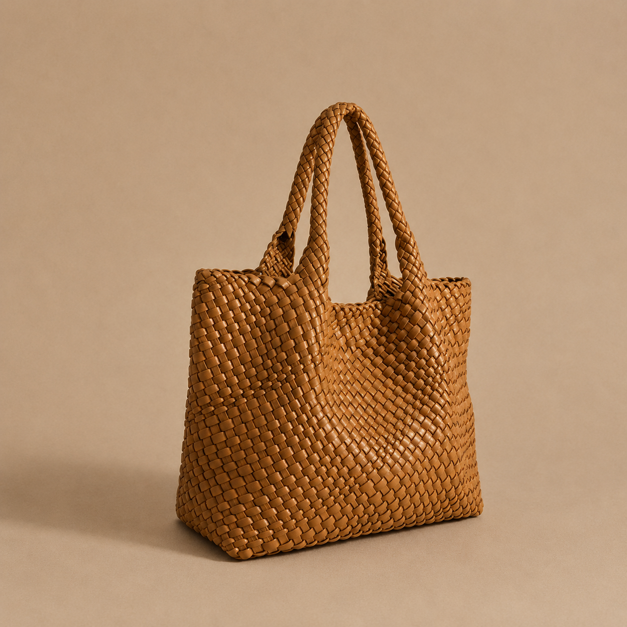 Womens woven tote bag with top handles, rust brown woven texture.