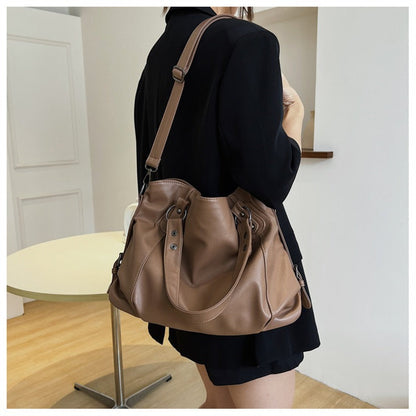 Taupe vegan leather handbag with two handles and detachable shoulder strap