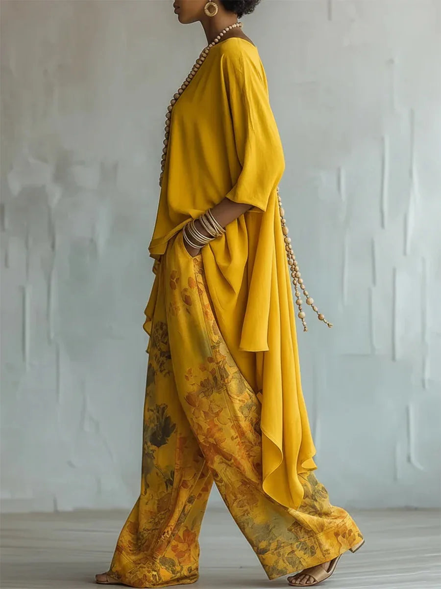 Yellow printed two-piece set with draped tunic and wide-leg pants, side view