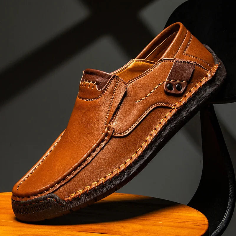 Men's caramel leather loafer with moc-toe stitching and strap with metal eyelet