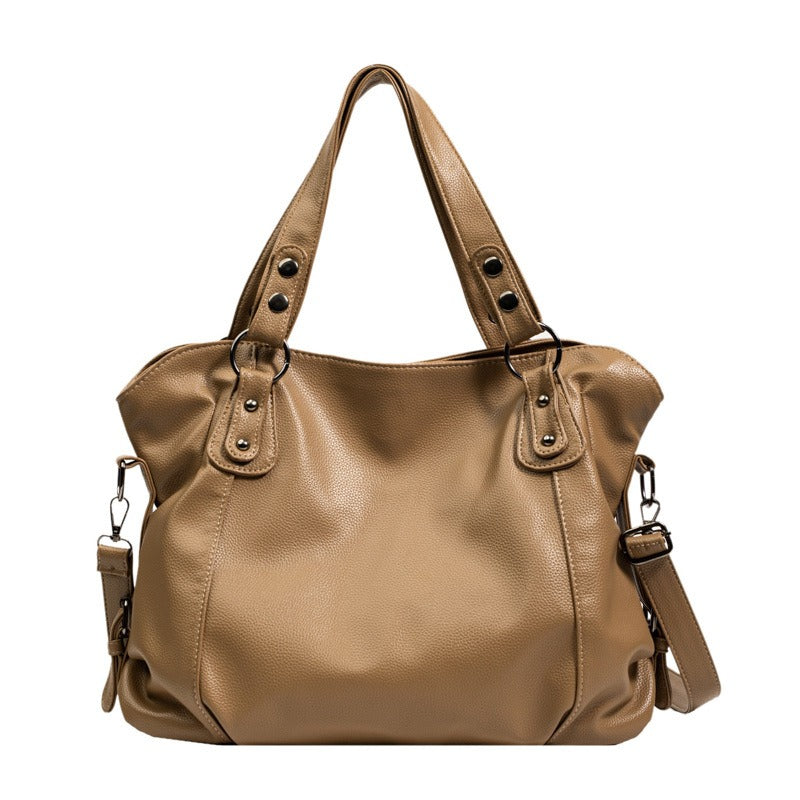 Beige vegan leather handbag with two top handles and detachable shoulder strap