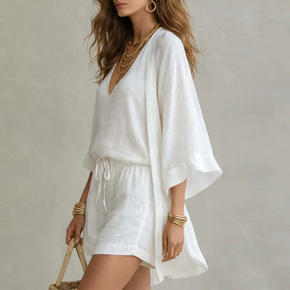 White linen three-piece set with open kimono, V-neck top, and drawstring shorts