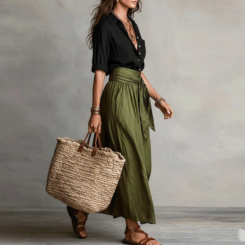 Linen co ord set: black wrap blouse with olive drawstring midi skirt, side view