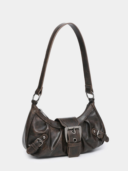 Brown faux leather hobo bag side view with adjustable strap and front buckle detail