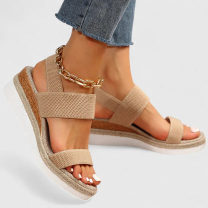 Beige comfort sandals with two wide straps, espadrille wedge sole, chain ankle strap