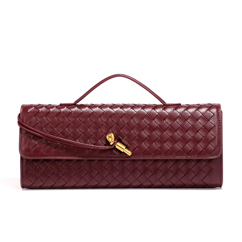 Maroon woven vegan leather clutch with gold turn-lock and top handle, fold-over flap