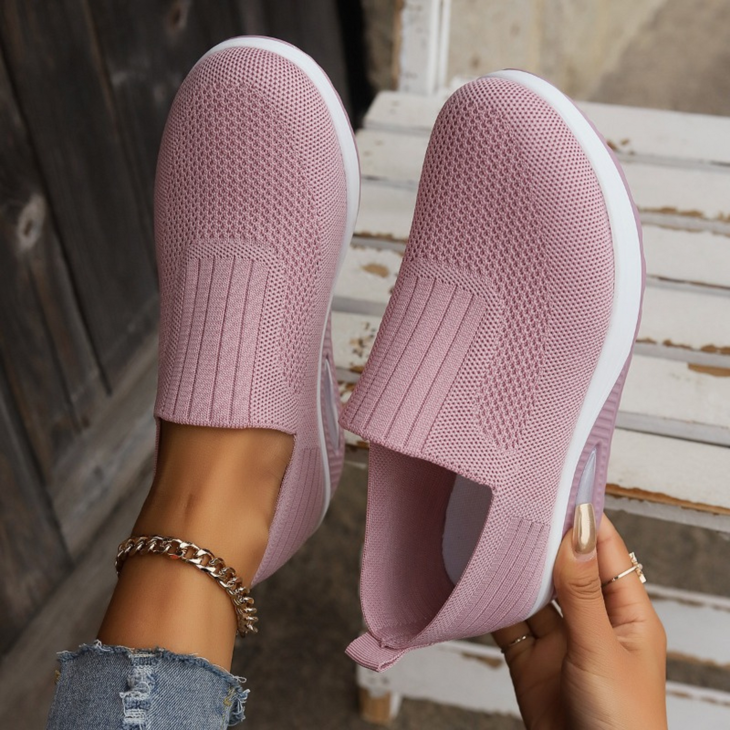 Pink knit slip-on walking shoes with cushioned sole and oval air-cushion window