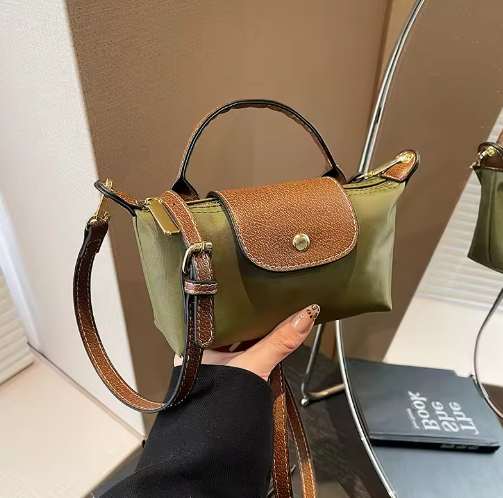 Mini leather pouch, olive green with brown front flap and gold snap, top handle and shoulder strap